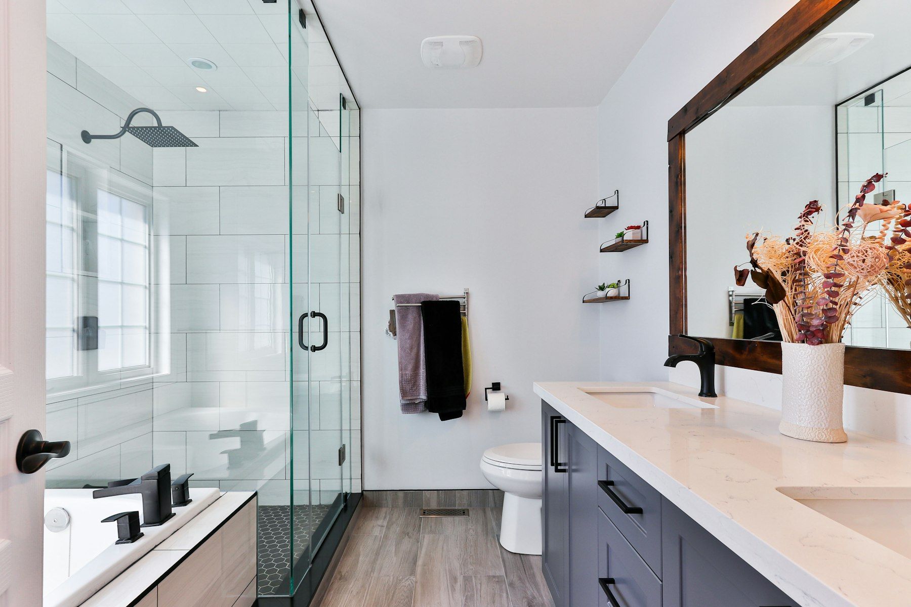 Bathroom with a glass-walled shower and a vanity